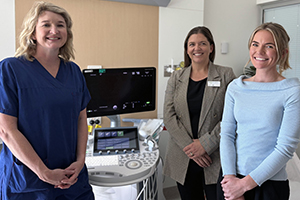 From left to right, Fiona Stanley Hospital Preterm birth team members Dr Sarah Rylance, Joanna Camilleri Nurse Director and Phoebe Backhouse, Clinical Midwifery Specialist stand together beside maternity equipment