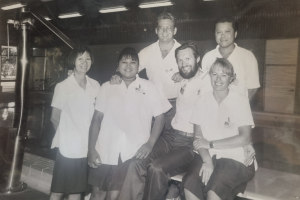 Eric pictured early on in his career, with former colleagues. 