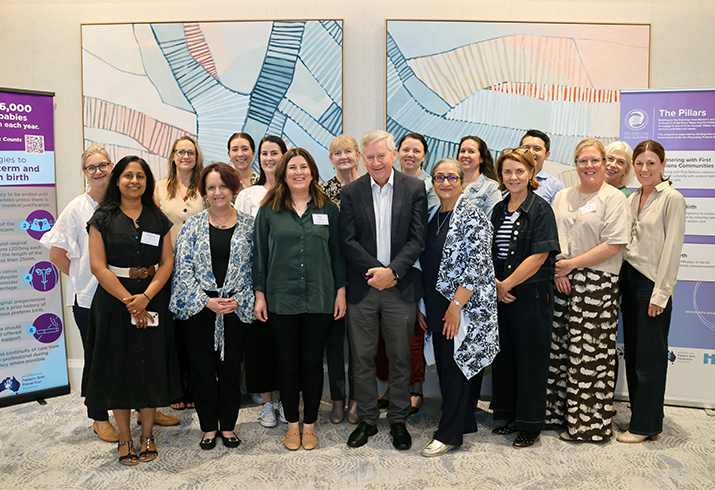 Two Fiona Stanley Hospital staff stand with a group of maternity health professionals at the Every Week Counts National Preterm Prevention Birth Collaborative