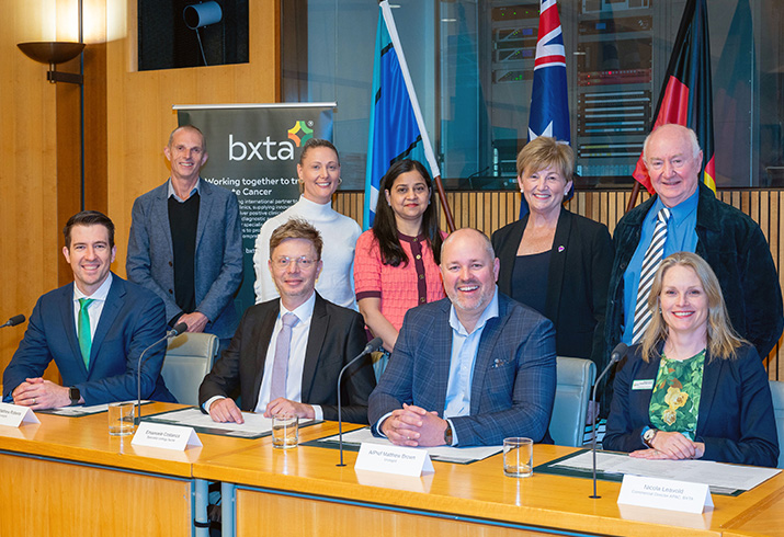 A group of nine men and women seated together at a prostate cancer care roundtable at Parliament House, Canberra.