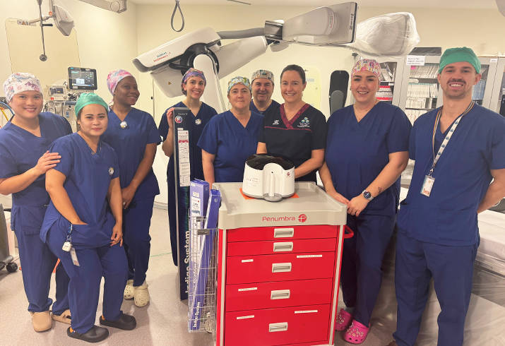 Interventional Radiology team standing together in theatre.