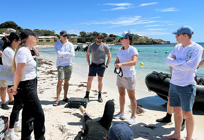 A group of Rottnest Island agency personnel on a live training exercise on a beach