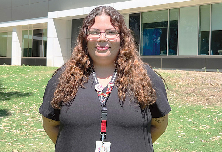 Aboriginal cadet Rubi Bates-Waltham stands outside a hospital building