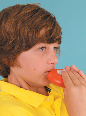 Child placing accuhaler on lips